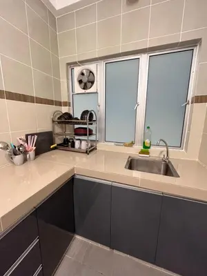 a kitchen with a sink and two windows at Cameron Emerald Avenue @ Brinchang in Cameron Highlands