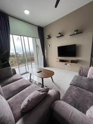 a living room with two couches and a television at Cameron Emerald Avenue @ Brinchang in Cameron Highlands