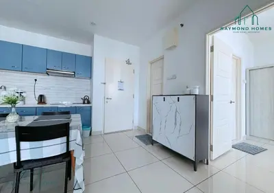 a kitchen with blue cabinets and a refrigerator at Gurney Drive Mansion One Serviced Apartment in George Town