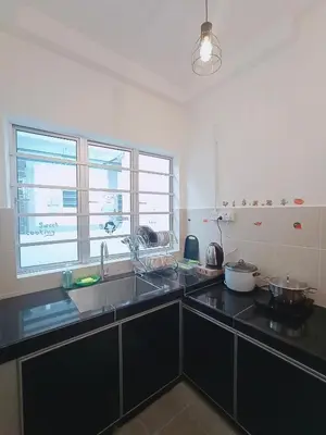 a kitchen with a sink and a large window at FuYoke Emerald Avenue @ Brinchang in Cameron Highlands