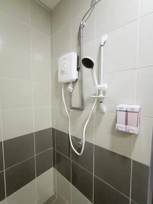 a shower in a bathroom with a blow dryer at FuYoke Emerald Avenue @ Brinchang in Cameron Highlands