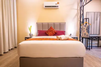 a bedroom with a bed with a dog laying on it at Cinta Abadi Resort in Bidur
