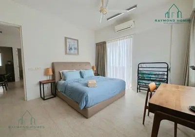 a bedroom with a bed and a dining room at Beachfront Resort By The Sea, Batu Ferringhi in Batu Ferringhi