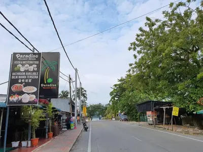 a street with a sign on the side of the road at Pangkor Coral Bay Resort(3 bedrooms) \u4f11\u606f\u5c0f\u7ad9 in Pangkor