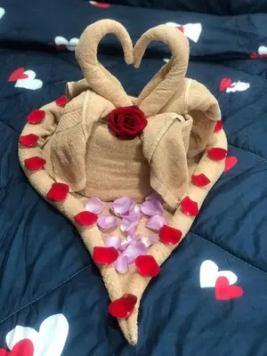 a heart shaped basket with a rose and hearts at Ramadhina Eagle Eye View Home2stay Emerald Avenue in Brinchang