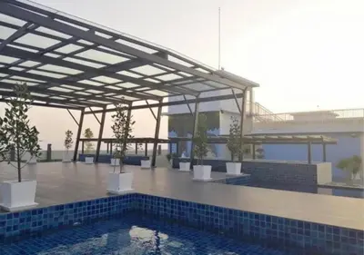 a patio with a pool and a pavilion with plants at \u805a\u4e50\u5c4b\u6c11\u5bbfJyuraku homestay The venus sitiawan in Sitiawan