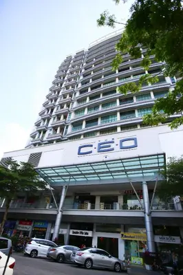 a large building with cars parked in front of it at Private Getaway (Private Cinema, Swing & more!) at CEO Penang in Bayan Lepas