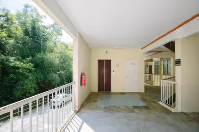 an empty hallway of a building with a balcony at EEs Whale House - Homestay 3 min walk to beach in Batu Ferringhi