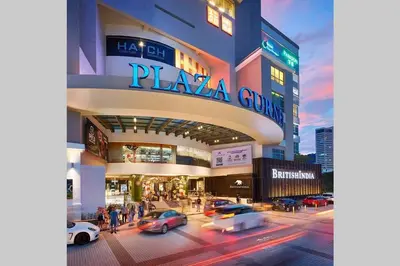 a rendering of a plaza casino with cars in the street at EEs Whale House - Homestay 3 min walk to beach in Batu Ferringhi