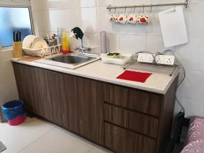 a kitchen with a sink and a counter top at Lily Homestay Barrington Square Cameron Highlands. in Brinchang