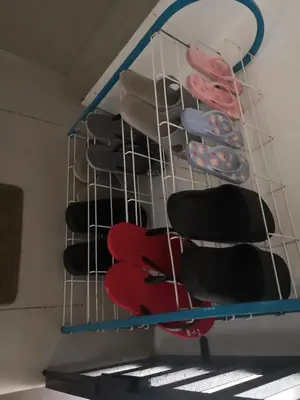 a rack filled with different colored chairs in a room at Lily Homestay Barrington Square Cameron Highlands. in Brinchang