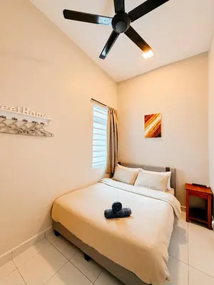 a bedroom with a bed with a ceiling fan at Golden Sweet Home @ Golden Hills (Night Market, \u591c\u5e02) in Tanah Rata