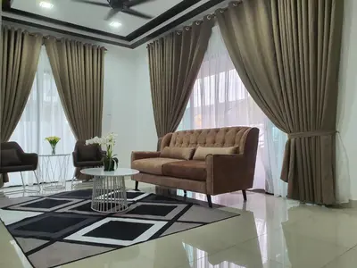 a living room with a couch and a table at Homestay D'Bertam, Kepala Batas, Penang, Muslim Saja in Kepala Batas