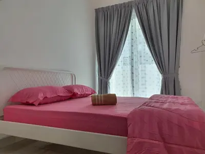 a bedroom with a bed with pink sheets and a window at Homestay D'Bertam, Kepala Batas, Penang, Muslim Saja in Kepala Batas