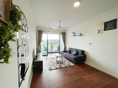 a living room with a couch and a table at Relax Bear Homestay in Tanah Rata