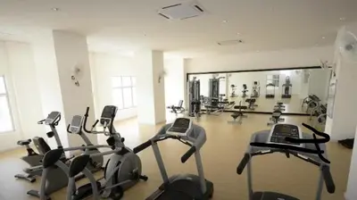 a gym with several cardio bikes in a room at Taiping Rain Town Homestay\u592a\u5e73\u96e8\u57ce\u540d\u5bbf two car park in Taiping