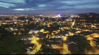 a view of a city at night with lights at Taiping Rain Town Homestay\u592a\u5e73\u96e8\u57ce\u540d\u5bbf two car park in Taiping
