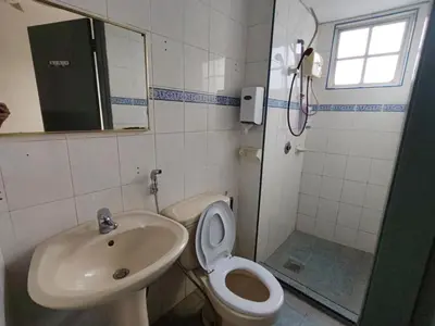 a bathroom with a sink and a toilet and a shower at Amy Home Moonlight Apartment, Cameron Highlands in Brinchang
