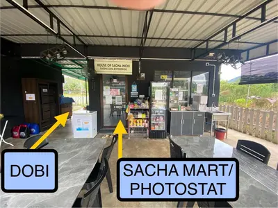 a store with two arrows pointing to aazaria mart photographer at Sacha Homestay in Baling