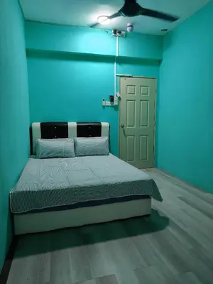 a blue room with a bed and a door at WORLD KIDS FANTASY in Lumut