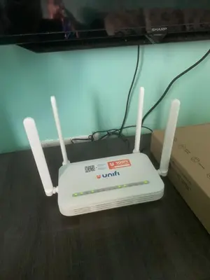 a white router sitting on top of a table at Fizan Homestay in Tanah Rata