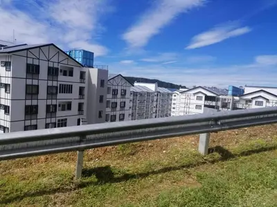 a view of buildings from a highway at Fizan Homestay in Tanah Rata