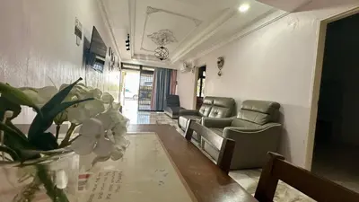 a waiting room with chairs and a table and flowers at Taman Bagan Single Storey Terrace House, 9mins to Sunway Carnival Mall, Seberang Jaya in Butterworth