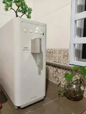 a white refrigerator in a kitchen with a plant at As Syifaa Homestay Mslim only in Ipoh