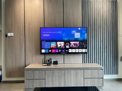 a flat screen tv on top of a wooden wall at The Quintet Cameron Highlands by Tulip in Tanah Rata