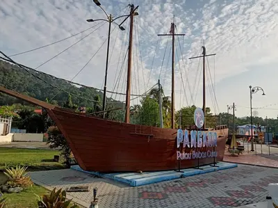 a large wooden boat on display in a park at Pangkor Happy Villa @ 88 Resort Villa Riadah in Kampong Sungai Udang