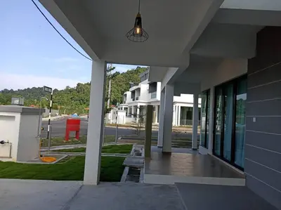 a building with a porch with a light on it at Pangkor Happy Villa @ 88 Resort Villa Riadah in Kampong Sungai Udang