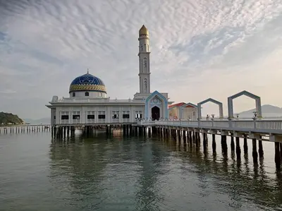 a mosque on a pier next to the water at Pangkor Happy Villa @ 88 Resort Villa Riadah in Kampong Sungai Udang