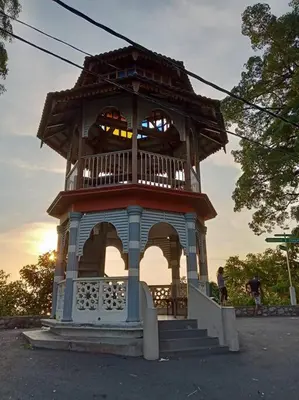 a small building with a tower on top of it at Pangkor Happy Villa @ 88 Resort Villa Riadah in Kampong Sungai Udang