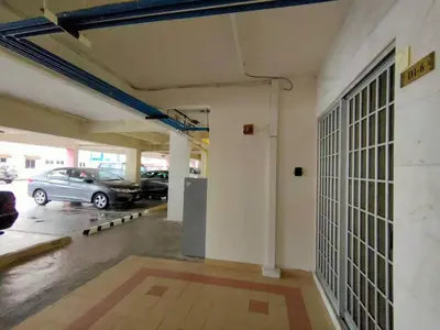 a garage with cars parked in a parking lot at Unicorn Homestay @ Cameron Highland in Tanah Rata