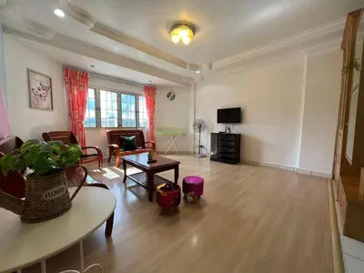 a living room with a couch and a table at Unicorn Homestay @ Cameron Highland in Tanah Rata