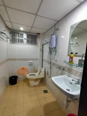 a bathroom with a shower and a toilet and a sink at Unicorn Homestay @ Cameron Highland in Tanah Rata