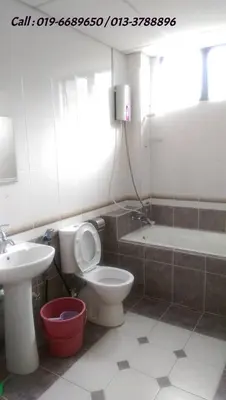 a bathroom with a toilet and a sink and a bath tub at Ar Rayyan Apartments Prima Villa in Tanah Rata
