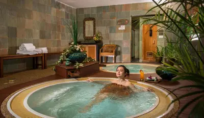 a woman in a hot tub in a hotel room at Pearl View Hotel Prai, Penang in Perai