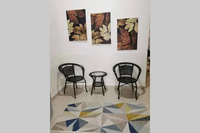 a group of chairs and a table in a room at Bintang Maya Residence cozy and comfortable stay in Sungai Petani