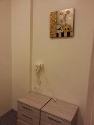 a room with a phone hanging on the wall at CH Green Stay Resort Apartment in Cameron Highlands