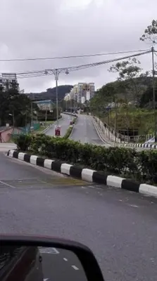 a view from a car of a road with at Zarena Somersquare Goldenhills Pasar Malam Tanah Rata Cameron Highlands in Tanah Rata