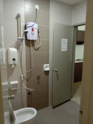 a bathroom with a shower stall with a toilet at Zarena Somersquare Goldenhills Pasar Malam Tanah Rata Cameron Highlands in Tanah Rata