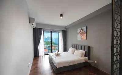 a bedroom with a bed and a large window at The Landmark by Katana - Your Home Away From Home in Tanjong Tokong