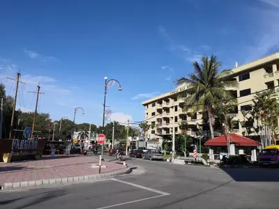 an empty city street with a building and a stop sign at Pangkor staycation apartment in Pangkor
