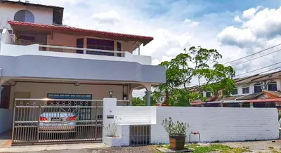 a house with a white fence in front of it at SS Ipoh Comfort Homestay - Taman Bertuah in Ipoh