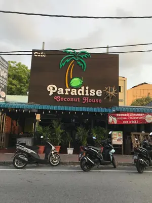 two motorcycles parked in front of a store at Pangkor Coralbay Resort 201 apartment in Pangkor