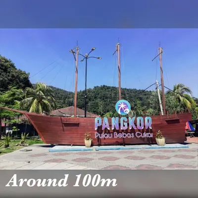 a large wooden boat in front of a sign at Pangkor Coralbay Resort 201 apartment in Pangkor