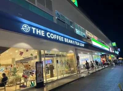 a store front of a coffee bean theatre at night at Airbnb at Sri Sayang Batu Ferringhi Beach in Batu Ferringhi