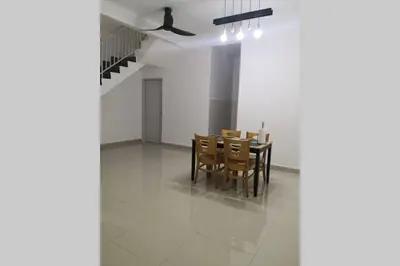 a dining room with a table and chairs at Homestay Tok Ayah, Behrang Jati in Kampung Behrang