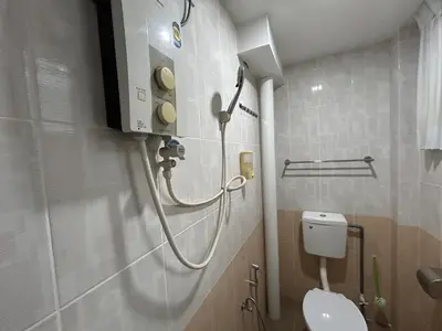a bathroom with a white toilet and a shower at Ipoh Comfortable Rooms Only-Private Bathrooms Indoor Car Parking SY30 in Ipoh